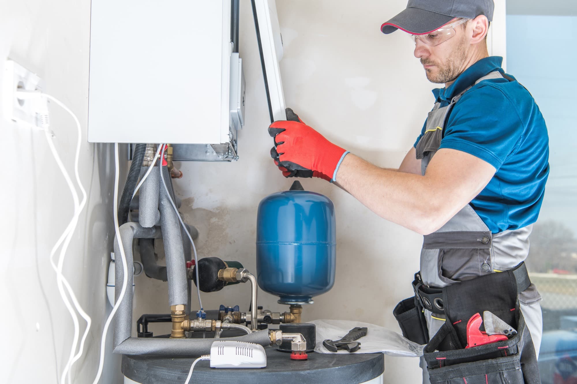 Technician installing a water heater